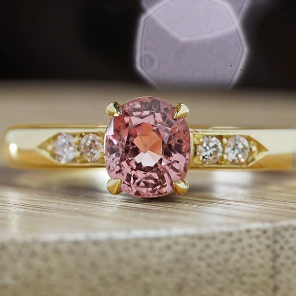 pink spinel ring on wooden box