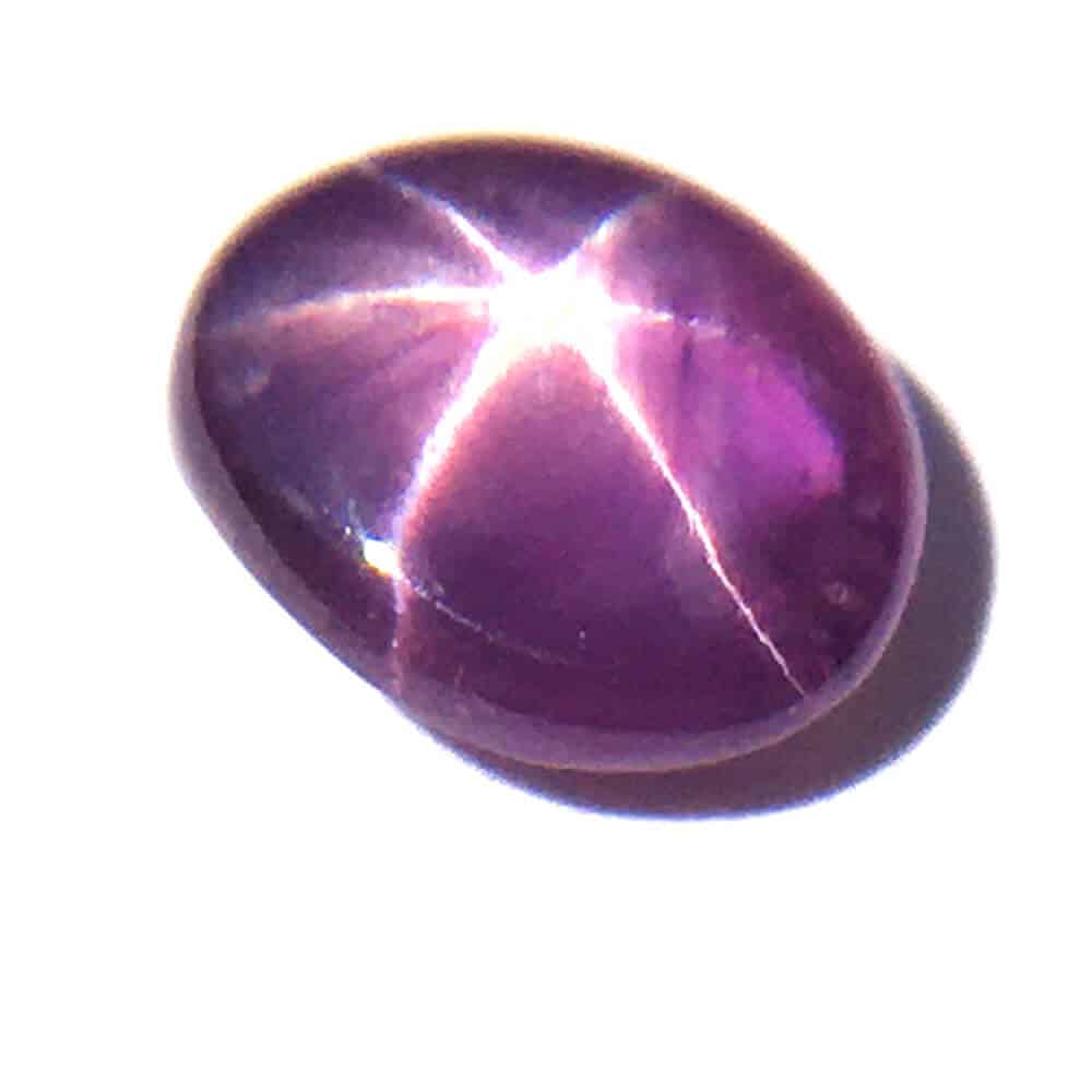 Six star oval cabochon ruby