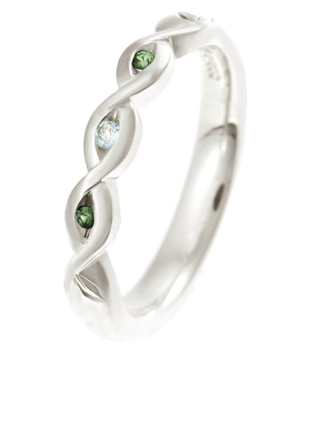 white gold Celtic twist style ring with gemstones