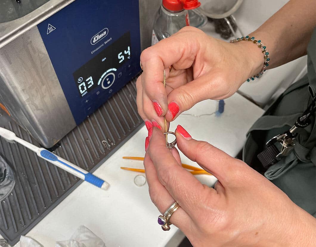 holding ring in jewellery cleaning workshop